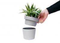 NAM-00065-hand-lifting-lid-from-plant-pot-tidy